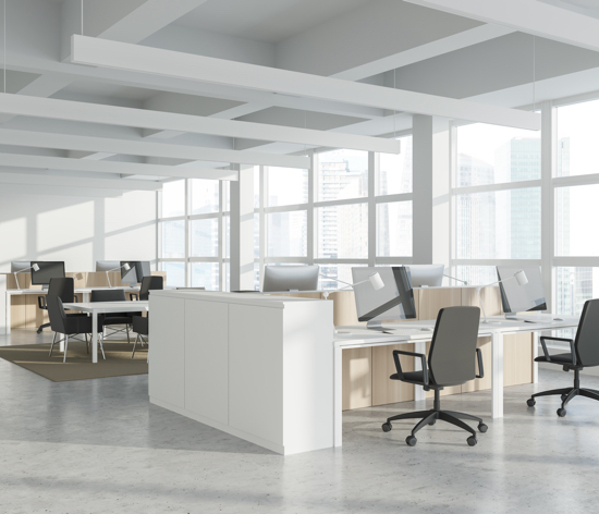 an empty office painted in white with workstations