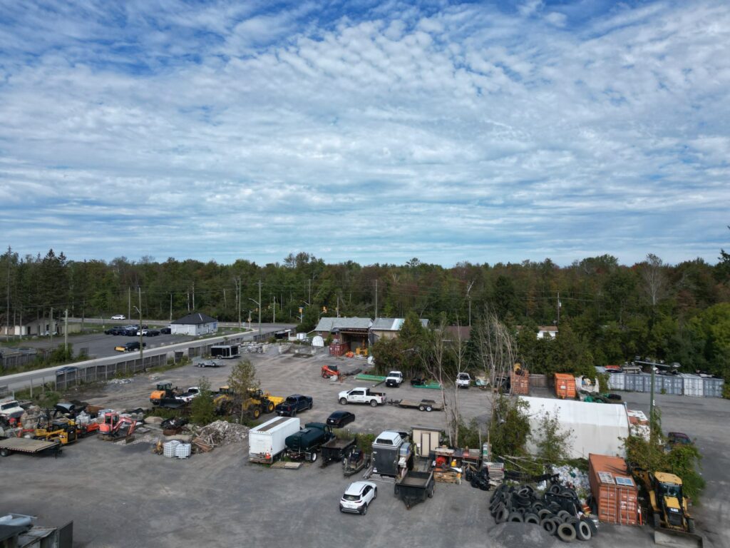 Large storage yard at 2538 Leitrim Road looking toward the tree line