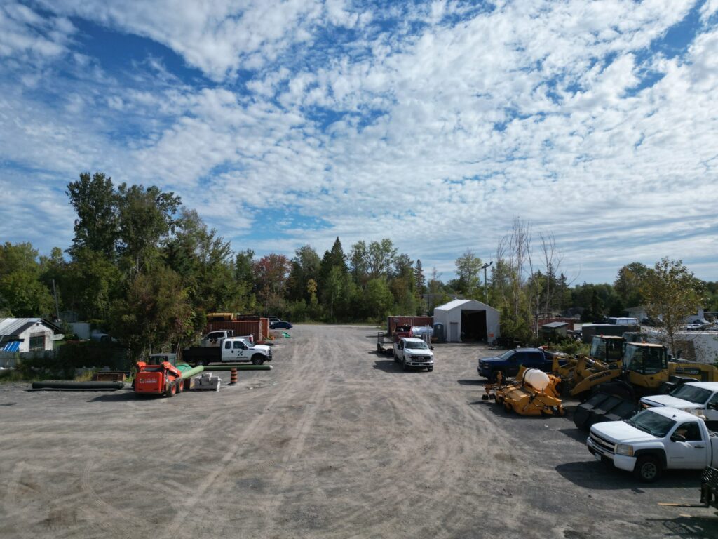 Open gravel surface and truck access in the large yard at 2538 Leitrim Road