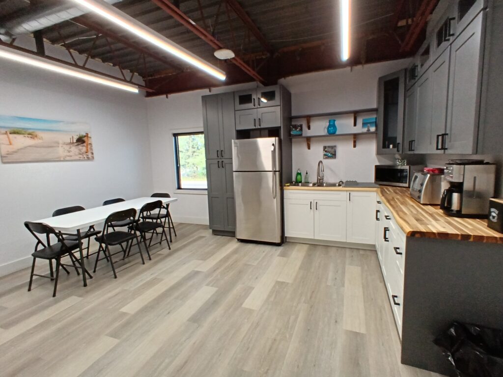 Lunchroom with dining table in the renovated office